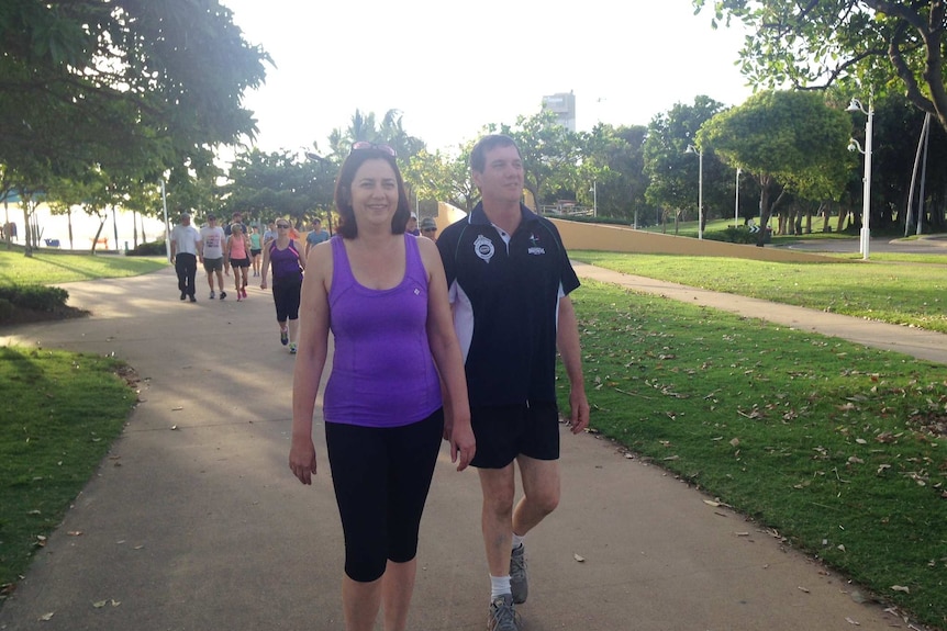 Ms Palaszczuk in her new workout clothes with Mr Stewart in Townsville.