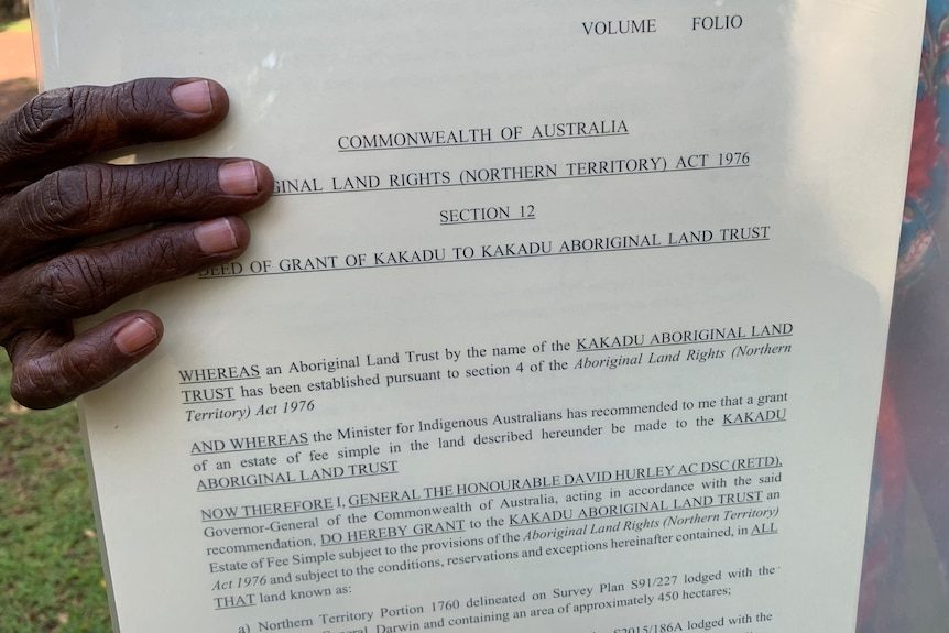 A document recognising the return of land part of Kakadu National Park to traditional owners.