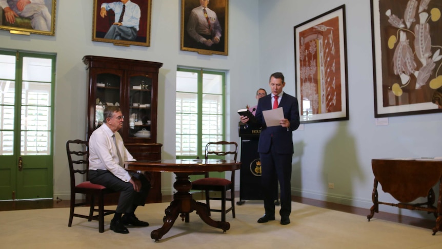 Michael Gunner is sworn in in a room at Darwin's Government House.