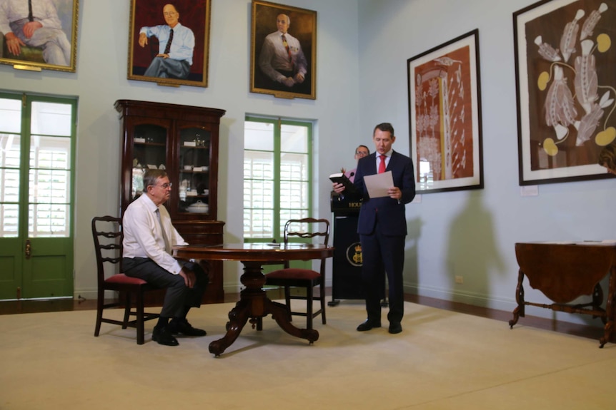 Michael Gunner is sworn in in a room at Darwin's Government House.