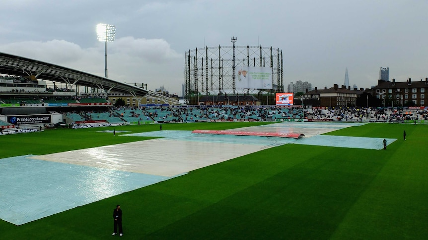 Covers come on at The Oval on day two of fifth Ashes Test