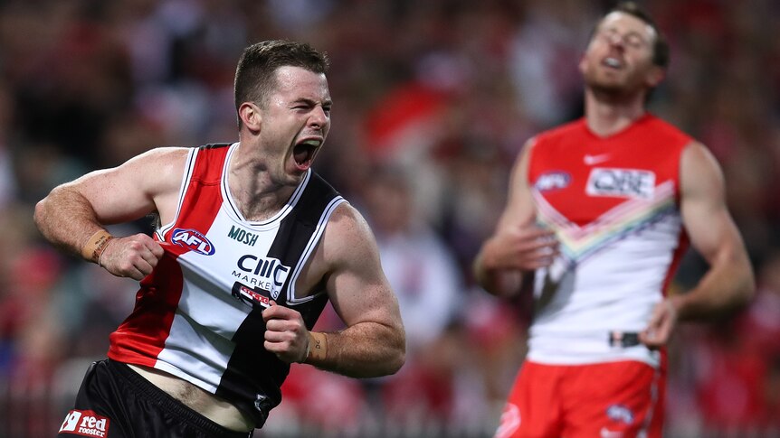 Jack Higgins flexes his muscles and yells in delight