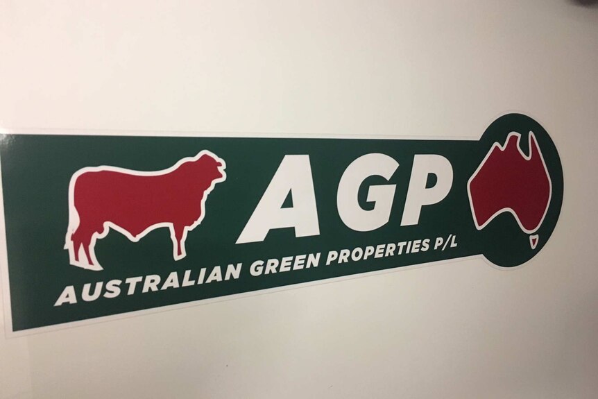 Australian Green Properties sign on wall features AGP name, a red bull and a red stylised map of Australia