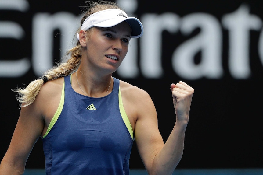 Caroline Wozniacki pumps her fist after winning a point against Magdalena Rybarikova at the Australian Open.