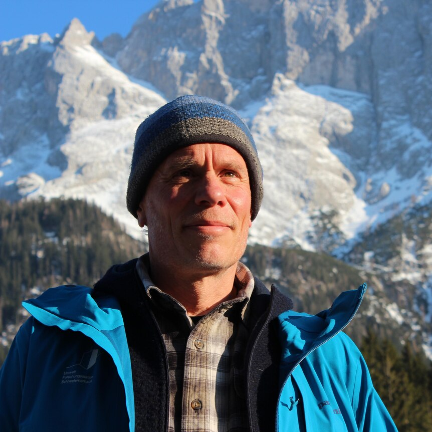 Hannes Vogelmann stands amongst the German alps