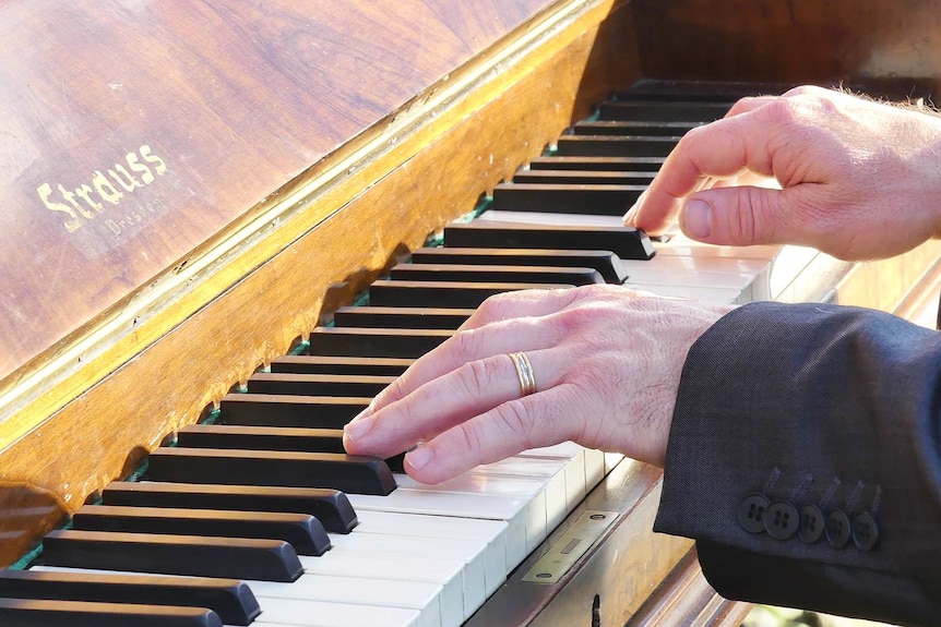 Kelvin Smith playing the piano.