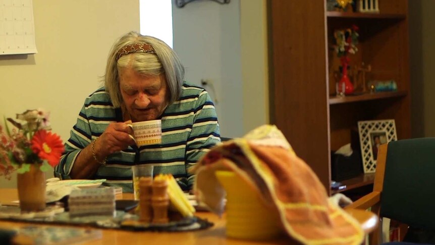 Joan says collecting bottles and cans allows her to afford coffee and cigarettes.
