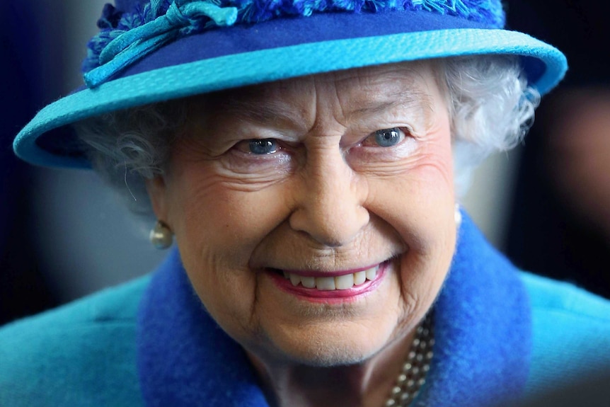 Queen Elizabeth II smiles.
