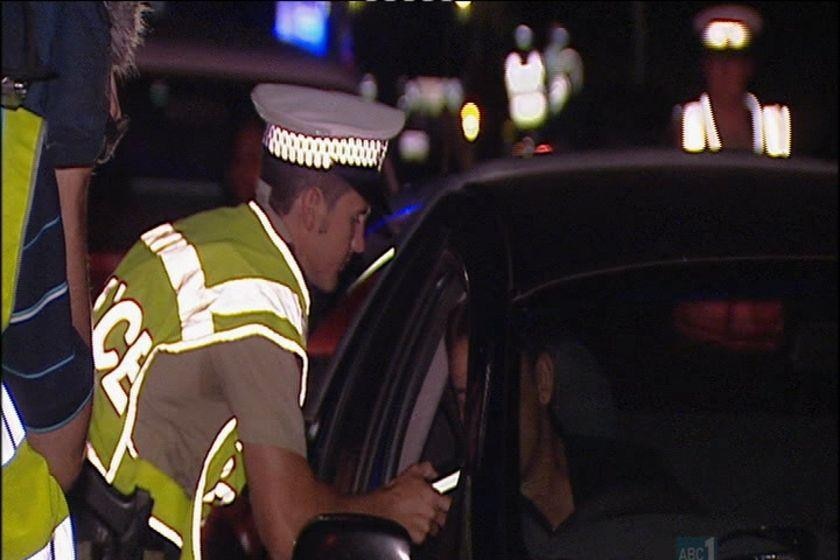 Drink driving ... police conduct random breath tests on drivers in Darwin.
