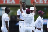 West Indies captain Jason Holder celebrates a wicket with team-mates against Sri Lanka in Colombo.