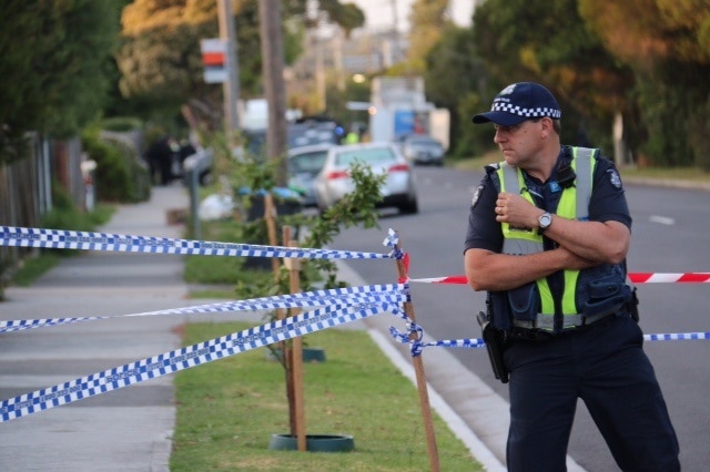 A Victoria Police officer at the scene of a standoff in Frankston