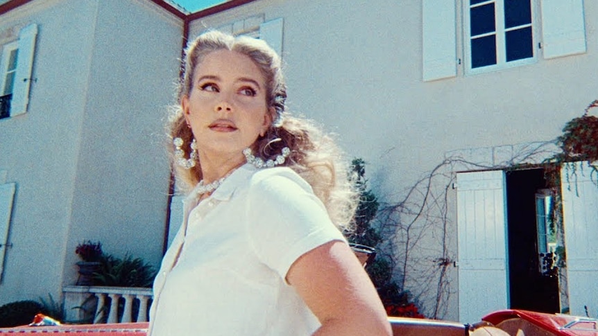 A video still from Lana Del Rey's 2021 music video for 'Chemtrails Over The Country Club'