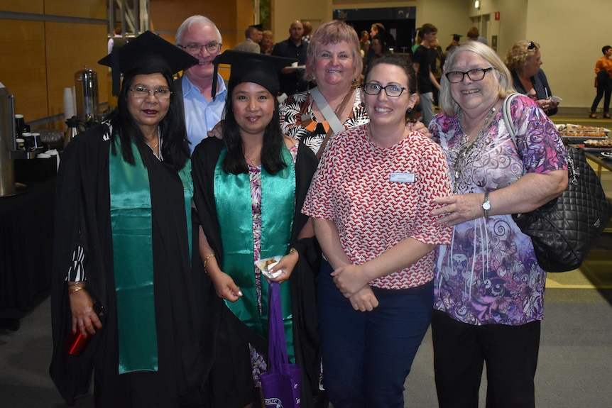 Risa Rosello with a group of people at her ACU graduation