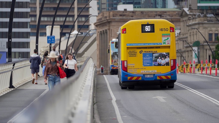 A bus driving over a bridge in Brisbane.