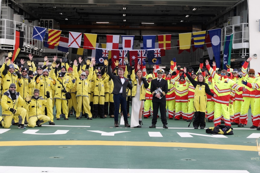 Briege Whitehead and Benn Ellard with the crew of the RSV Nuyina.