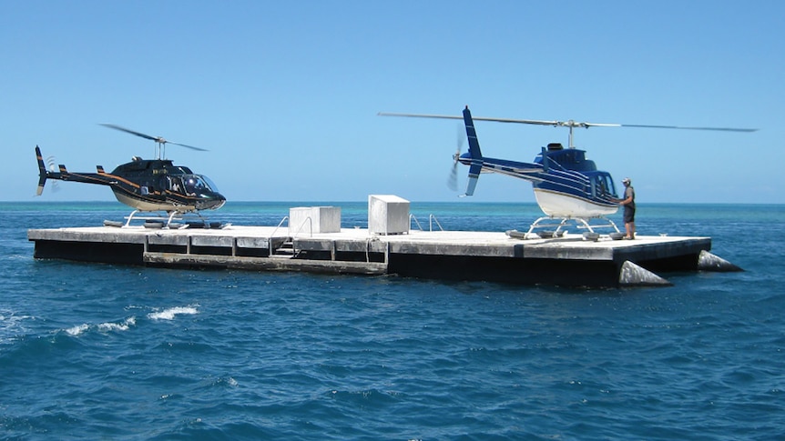 Two helicopters on a pontoon at Hardy Reef