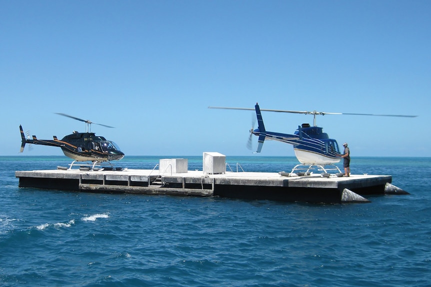 Two helicopters on a pontoon at Hardy Reef