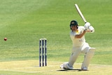 Marnus Labuschagne holds his bat up after playing a shot