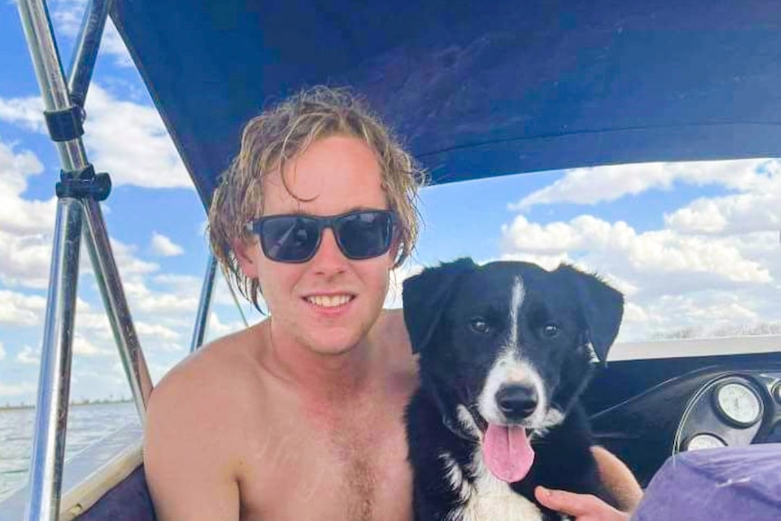 Boy on boat with dog