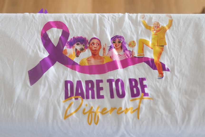 A tablecloth with dare to be different screen printed on it.