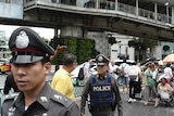 Thai police on patrol as authorities increase security following a new string of bomb attacks in Thailand.