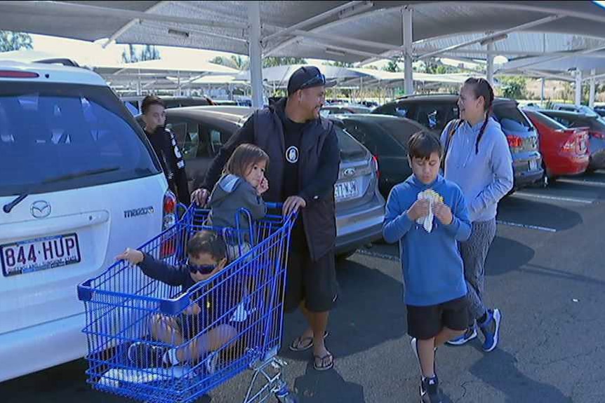 The Pirake family, with some kids in a trolley, at the end of a shopping trip