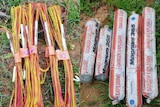 Red and yellow detonation cables and explosive materials