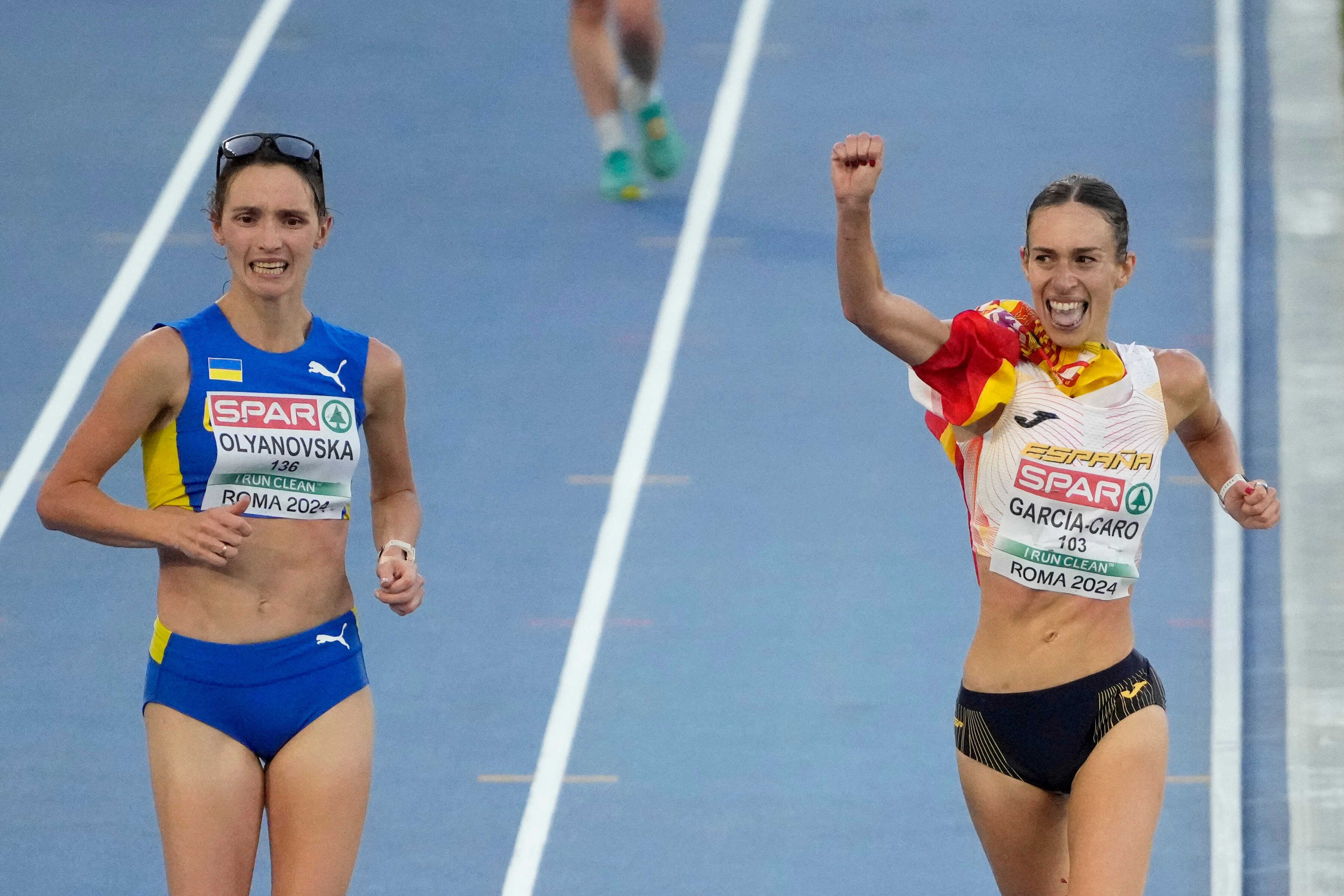 Laura Garcia-Caro celebrates next to Lyudmila Oluanovska