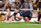 Michael Morgan dives in for the game-winning try against Brisbane