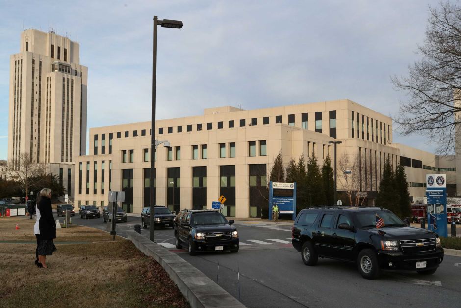 Image of hospital building, presidential cars in foreground