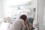 couple kissing in hospital room