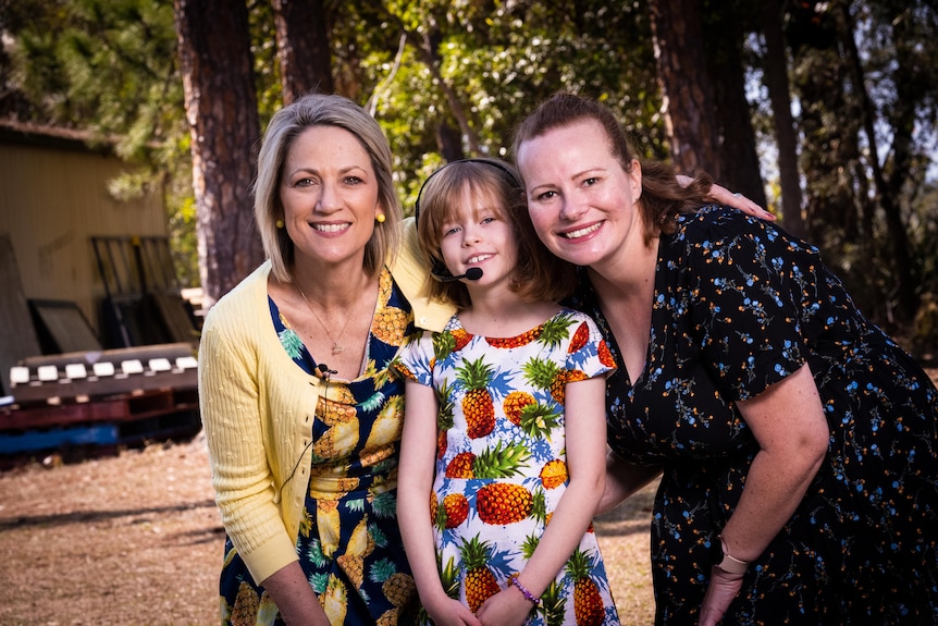 Three women outside in the sun