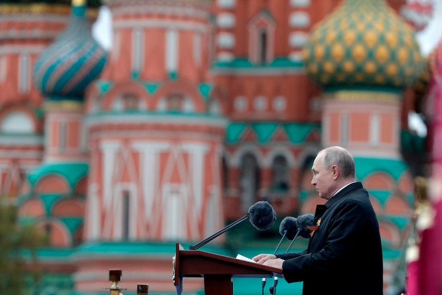 Vladimir Putin delivers a speech in front of Saint Basil's Cathedral in Moscow