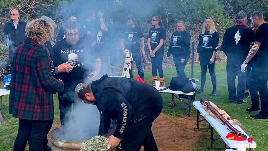 Kaurna people overlook a ceremonial campfire