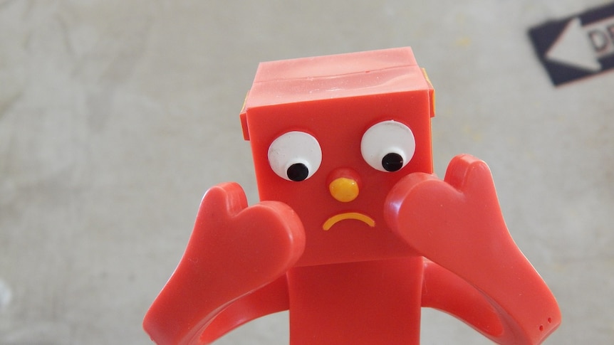 Sad cartoon red gumby man