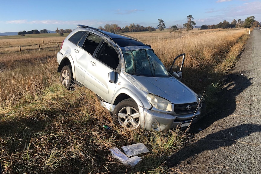 A silver SUV with smashed windscreen after crash on Federal Highway