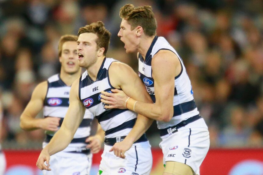 Geelong's Jordan Murdoch (C) celebrates after his goal against Collingwood at the MCG.