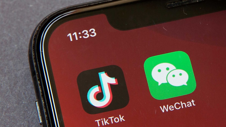 Icons for the smartphone apps TikTok and WeChat are seen on a smartphone screen