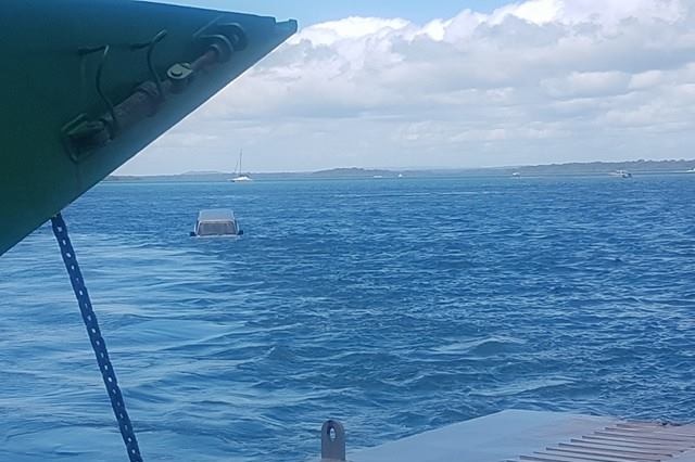 A four-wheel drive has fallen off a barge