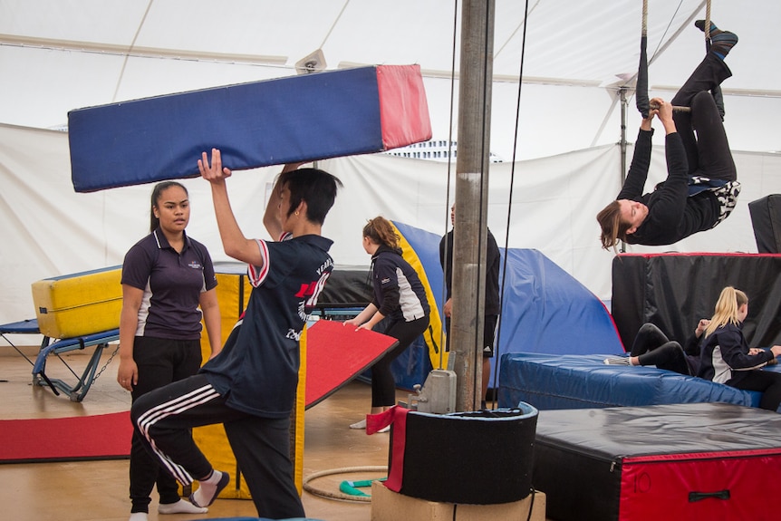 Students practise acrobatics at Circus SmARTs.