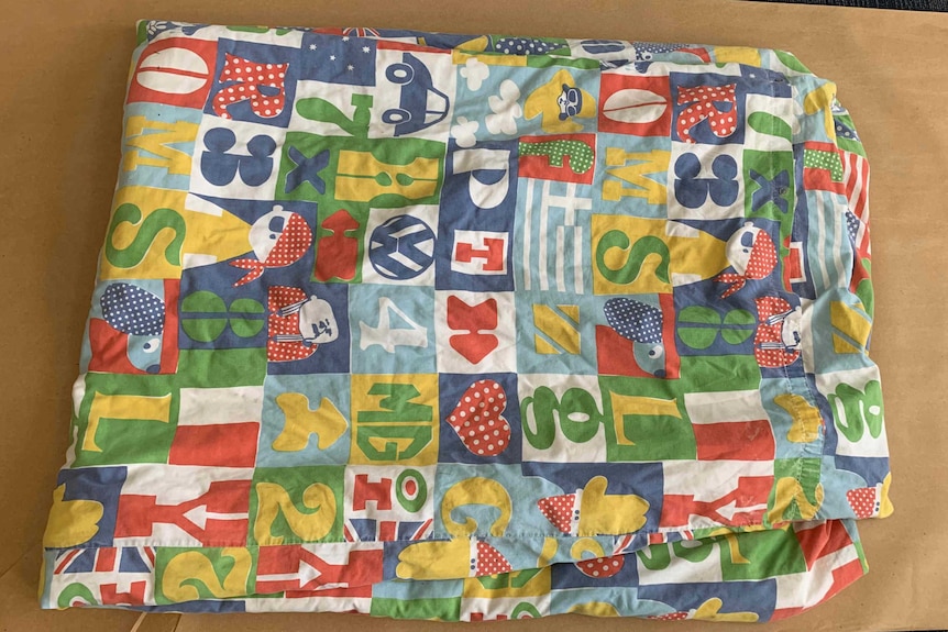 A child's blanket found in bushland where prison escapee Graham Enniss was found.