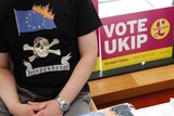 A UK Independence Party supporter shows their colours