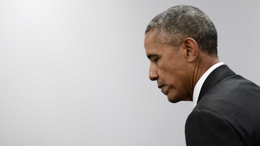 US President Barack Obama leaves after posing for a photo after a meeting during the NATO summit.