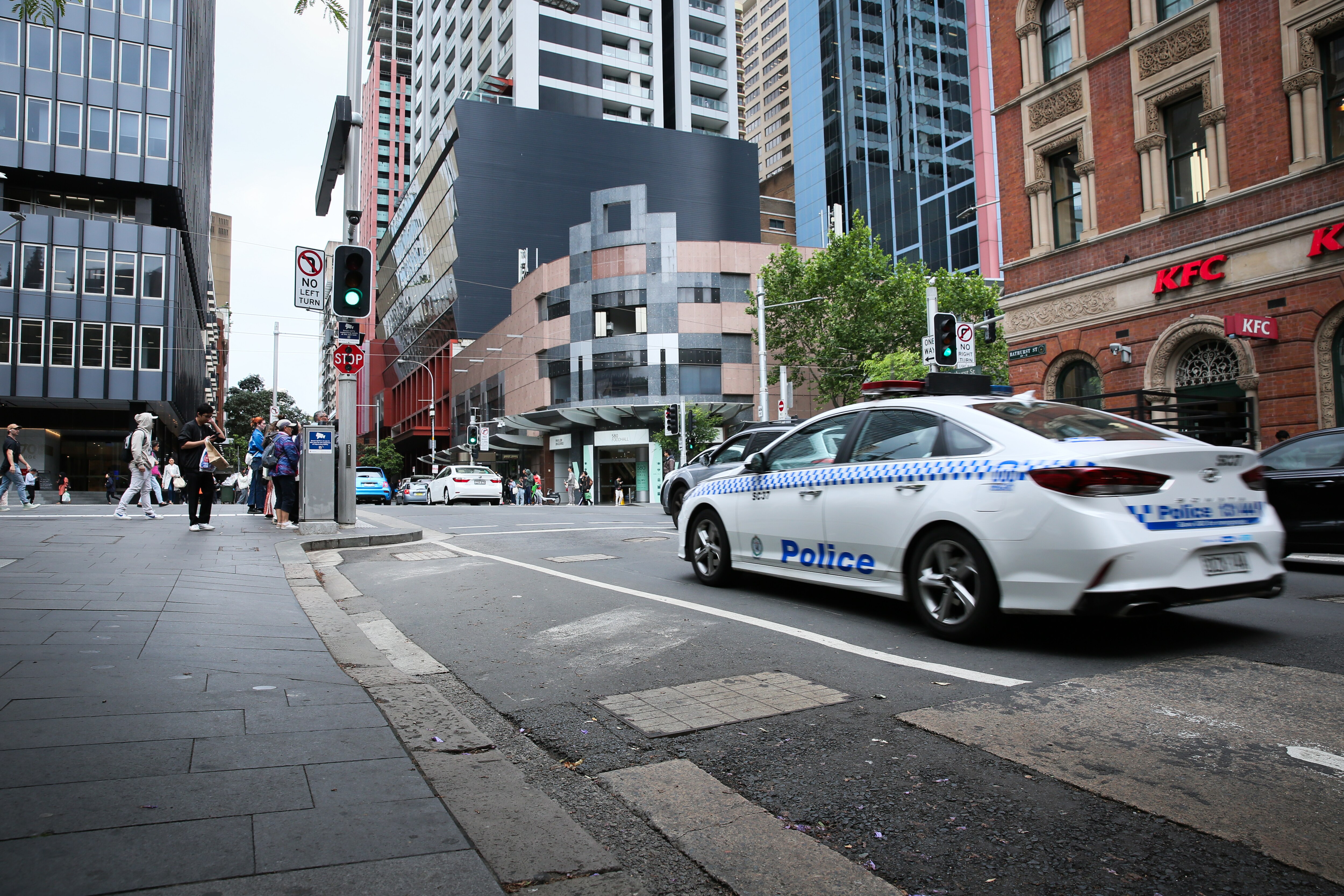 Police car leaves St Andrew's Cathedral School