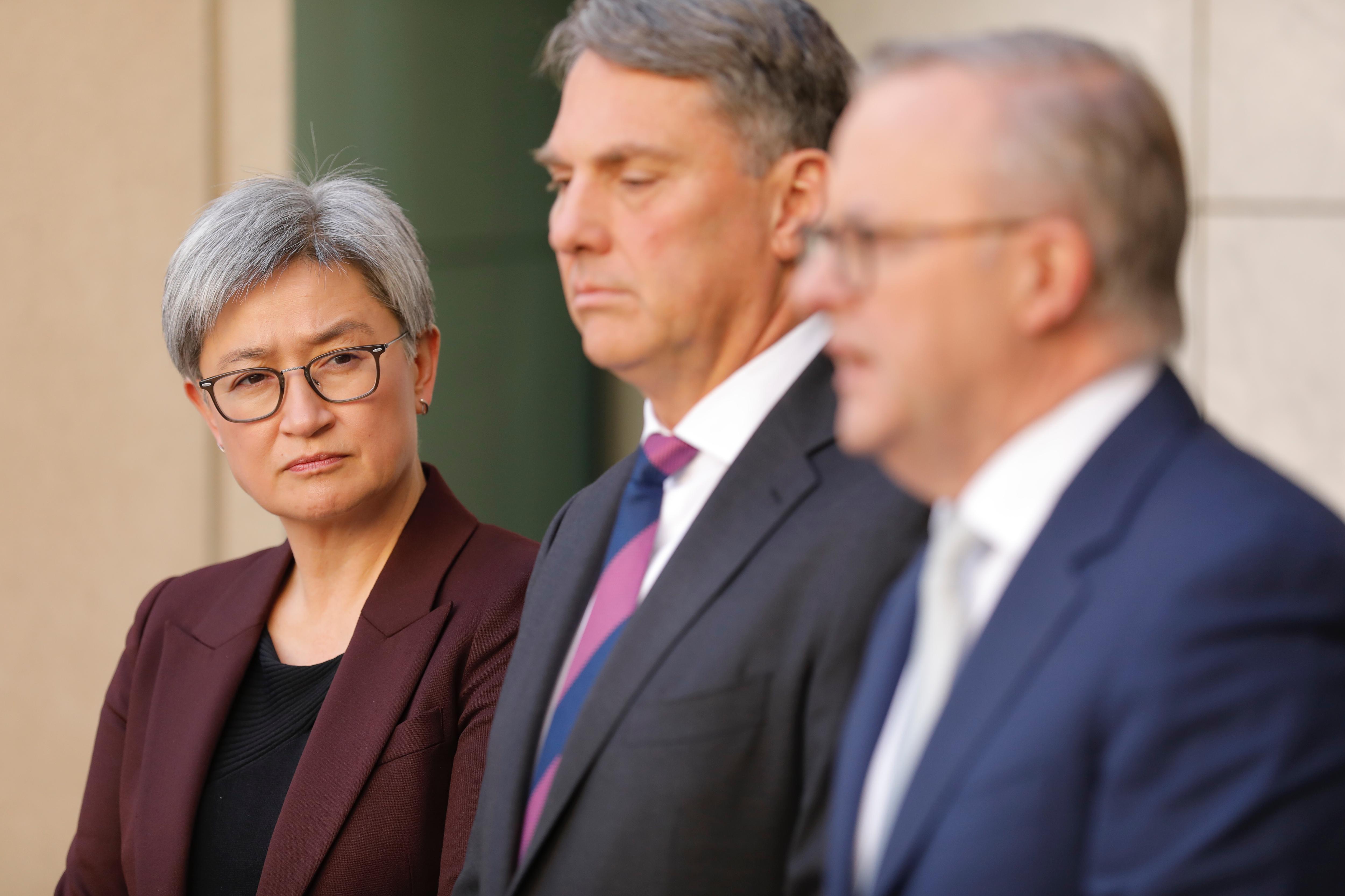 Penny Wong, Richard Marles and Anthony Albanese at a press conference 