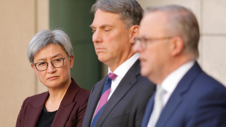Penny Wong, Richard Marles and Anthony Albanese at a press conference 