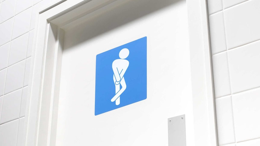 A toilet door with the stick figure crossing legs as if desperate for the toilet.