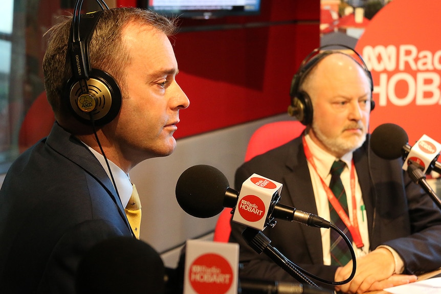 Michael Ferguson and Mark Veitch side by side in a radio studio.