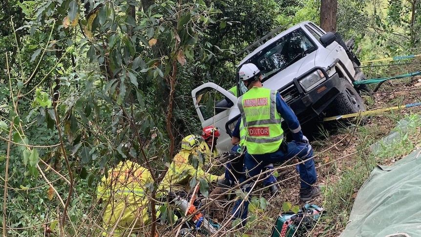 Emergency services rescuing the trapped man