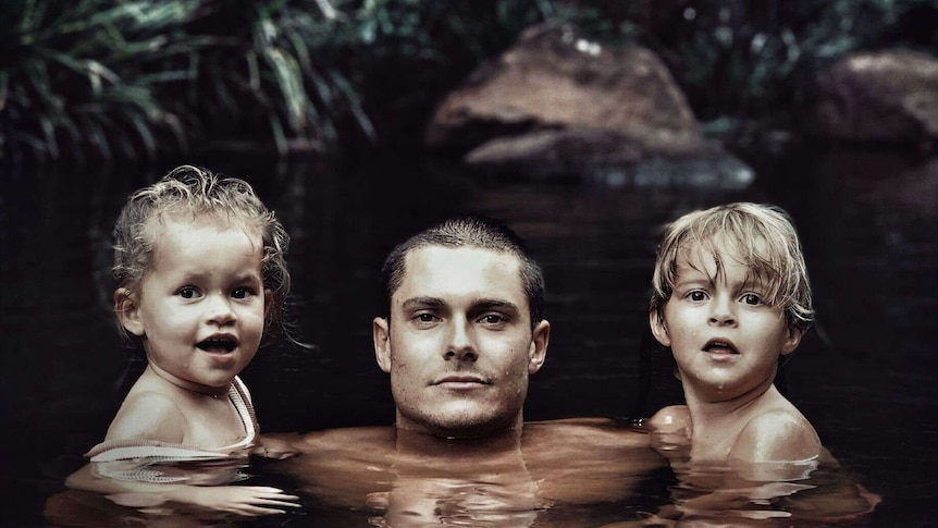 Nicholas Couldwell with son and daughter in water